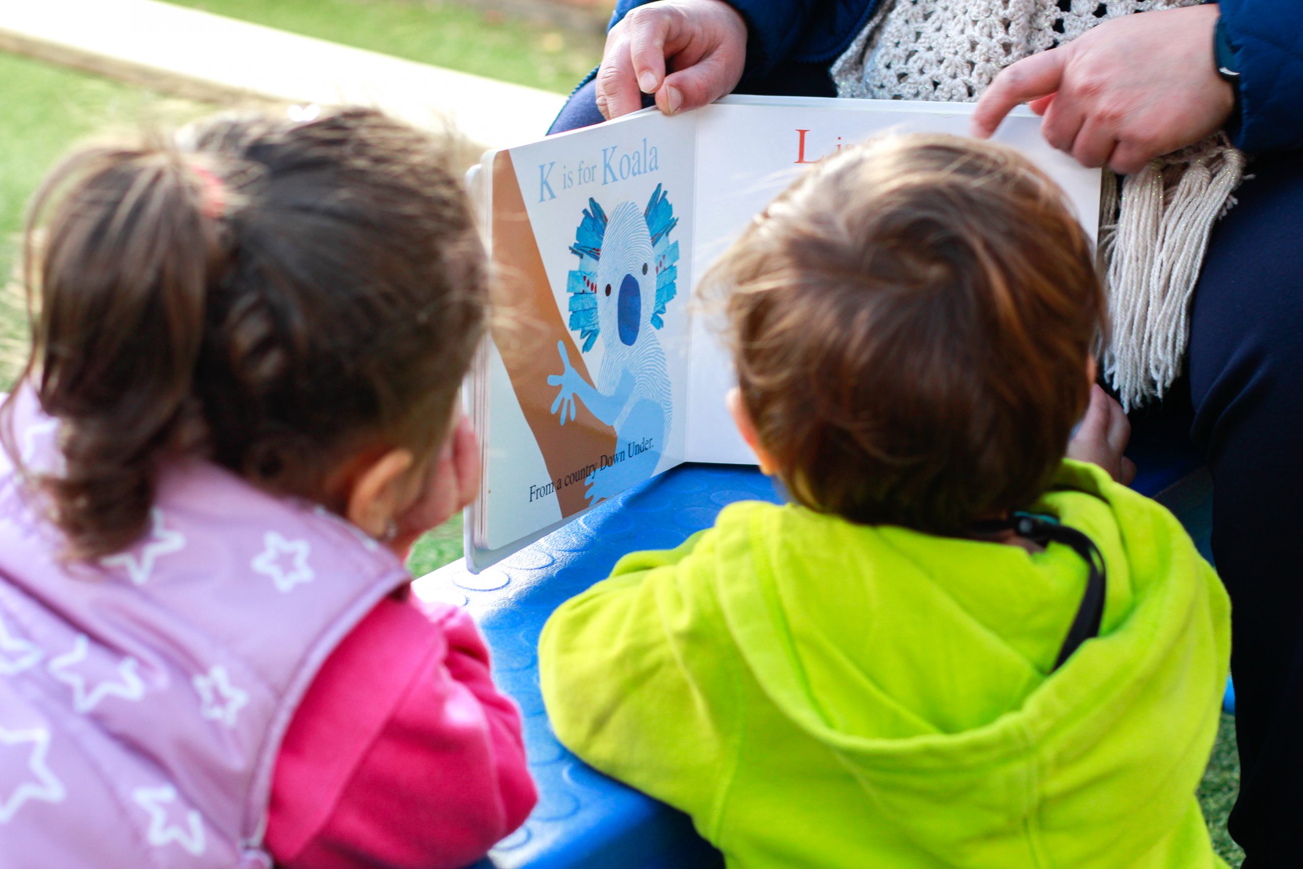 Kids reading book at Greystanes long day care centre